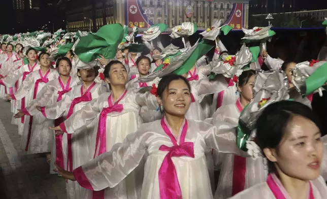 North Koreans celebrate the country's 76th founding anniversary at Kim Il Sung Square in Pyongyang, North Korea Sunday, Sept. 8, 2024. (AP Photo/Cha Song Ho)