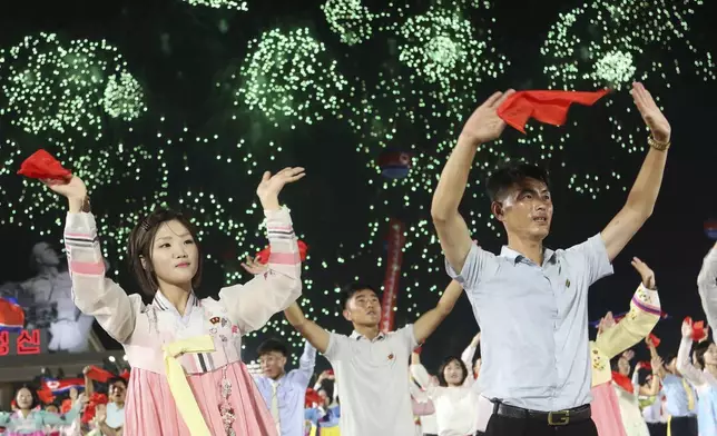 North Koreans celebrate the country's 76th founding anniversary at Kim Il Sung Square in Pyongyang, North Korea Sunday, Sept. 8, 2024. (AP Photo/Jon Chol Jin)