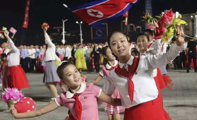 North Korean dance during an evening gala as they celebrate the country's 76th founding anniversary at Kim Il Sung Square in Pyongyang, North Korea Sunday, Sept. 8, 2024. (AP Photo/Jon Chol Jin)