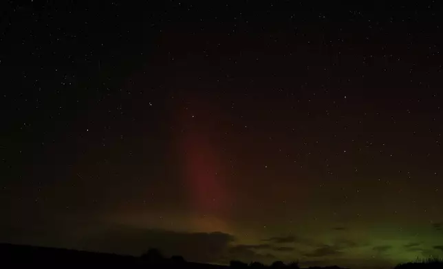 An aurora borealis, also known as the northern lights, is seen in the night sky with the Big Dipper constellation on Tuesday, Sept. 24, 2024, near Washtucna, Wash. (AP Photo/Ted S. Warren)