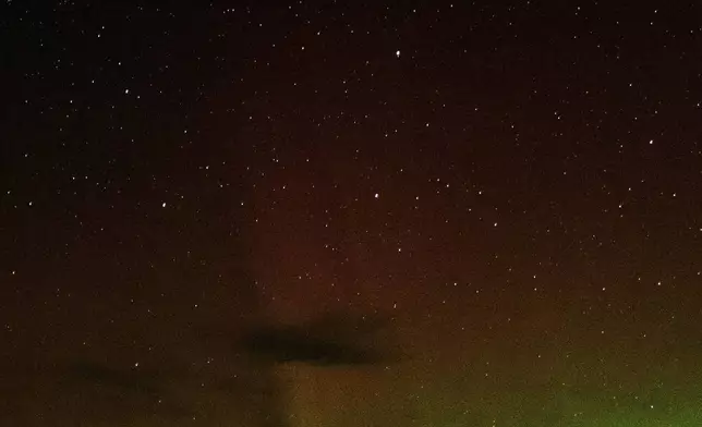 An aurora borealis, also known as the northern lights, is seen in the starry night sky on Tuesday, Sept. 24, 2024, near Washtucna, Wash. (AP Photo/Ted S. Warren)