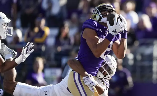 Washington wide receiver Denzel Boston catches a touchdown against Northwestern defensive back Theran Johnson during the first half of an NCAA college football game Saturday, Sept. 21, 2024, in Seattle. (AP Photo/Lindsey Wasson)