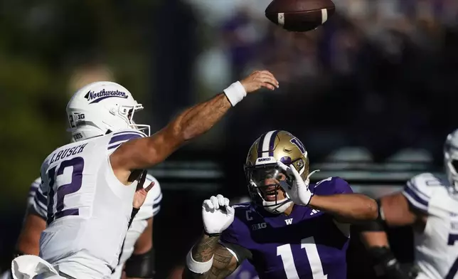 Northwestern quarterback Jack Lausch (12) is pressured by Washington linebacker Alphonzo Tuputala (11) during the first half of an NCAA college football game Saturday, Sept. 21, 2024, in Seattle. (AP Photo/Lindsey Wasson)