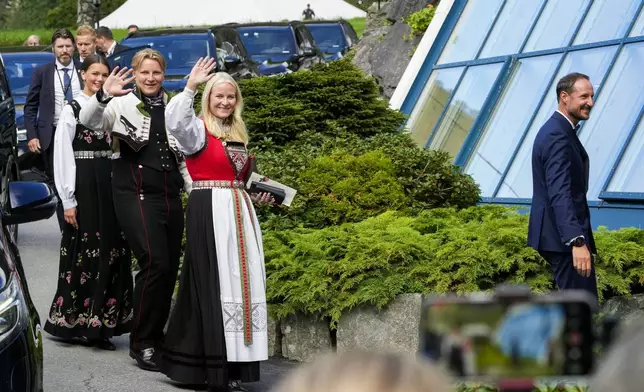 From right, Norway's Crown Prince Haakon, Crown Princess Mette-Marit, Prince Sverre Magnus and Amalie Givaer MacLeod attend the wedding of Norway's Princess Martha Louise and Durek Verrett, in Geiranger, Norway, Saturday Aug. 31, 2024. (Cornelius Poppe/NTB via AP)