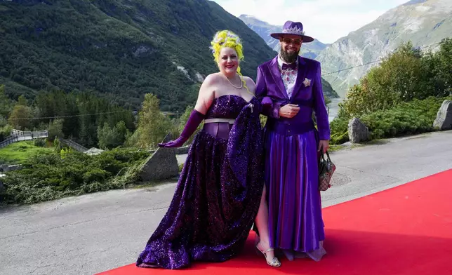 Margie Plus and Harald Austad attend the wedding of Norway's Princess Martha Louise and Durek Verrett, in Geiranger, Norway, Saturday Aug. 31, 2024. (Cornelius Poppe/NTB via AP)