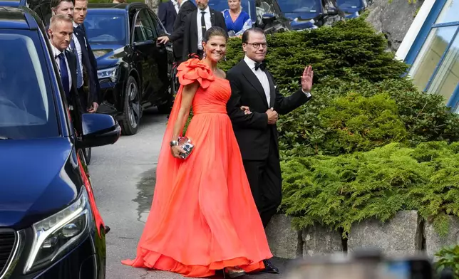 Sweden's Crown Princess Victoria and Prince Daniel of Sweden attend the wedding of Norway's Princess Martha Louise and Durek Verrett, in Geiranger, Norway, Saturday Aug. 31, 2024. (Cornelius Poppe/NTB via AP)