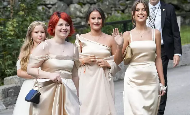 The daughters of Norway's Princess Martha Louise, Maud Angelica Behn, Emma Tallulah Behn and Leah Isadora Behn, in Geiranger, Norway, Saturday Aug. 31, 2024, during the wedding of Princess Martha Louise and Durek Verrett. (Cornelius Poppe/NTB via AP)