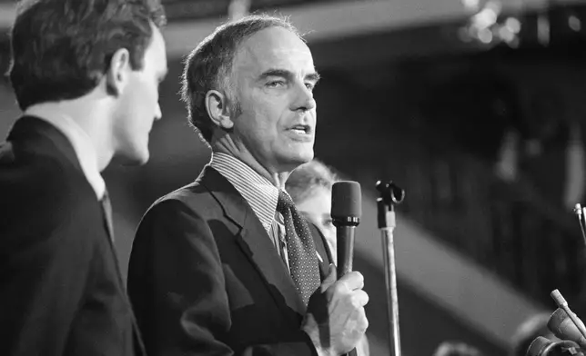 Sen. Dan Evans (R-Wash.) stands with his son Dan Jr., after he won the primary election for the senate seat for Washington State, Oct. 12, 1983. (AP Photo/Barry Sweet, File)