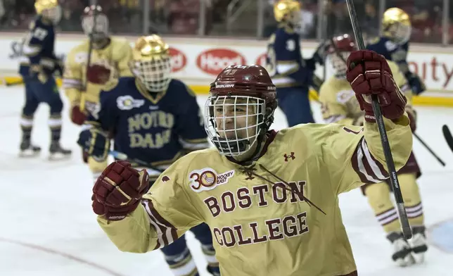 Boston College NCAA college hockey player Johnny Gaudreau celebrates his goal against Notre Dame during the third period of quarterfinal round match at the Hockey East Tournament in Chestnut Hill, Mass., March 15, 2014. (Matthew J. Lee/The Boston Globe via AP)