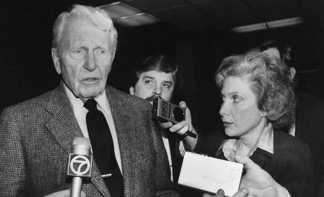 FILE - Actor Ralph Bellamy is interviewed by Associated Press special writer Linda Deutsch during the "Twilight Zone" trial in Los Angeles, Calif., March 9, 1987. (AP Photo/ Nick Ut, File)