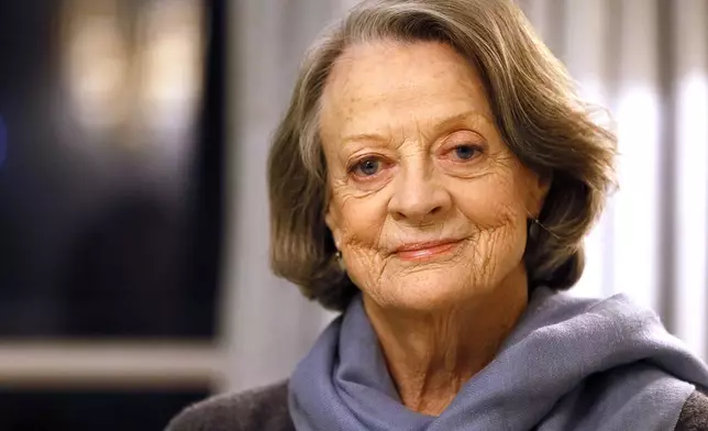 FILE - British actress Dame Maggie Smith poses in London on Dec. 16, 2015. Smith, who won an Oscar for “The Prime of Miss Jean Brodie” in 1969 and won new fans in the 21st century as the dowager Countess of Grantham in “Downton Abbey,” has died at 89. (AP Photo/Kirsty Wigglesworth, File)