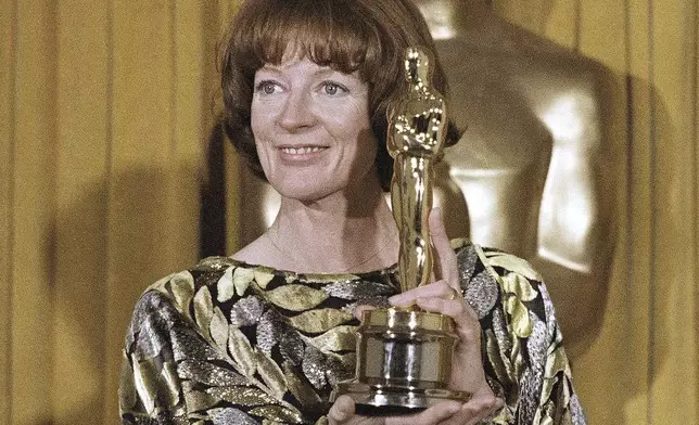 FILE - Actress Maggie Smith holds her Oscar for best supporting actress in the film "California Suite" in Los Angeles, April 9, 1979. Smith, who won an Oscar for “The Prime of Miss Jean Brodie” in 1969 and won new fans in the 21st century as the dowager Countess of Grantham in “Downton Abbey,” has died at 89. (AP Photo/Reed Saxon, File)