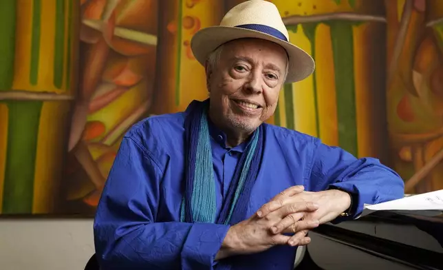 FILE - Brazilian musician Sergio Mendes sits for a portrait at home in Los Angeles, May 18, 2021. (AP Photo/Chris Pizzello, File)