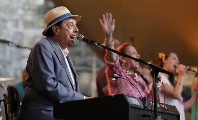 FILE - Sergio Mendes performs with his wife, Gracinha Leporace, center, at the Castello di Amorosa in Calistoga, Calif., on Wednesday, July 20, 2016, as part of the Festival Napa Valley. (AP Photo/Eric Risberg, File)