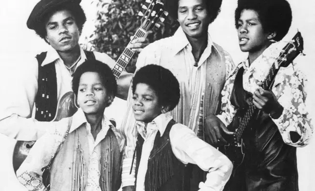 FILE - The Jackson 5, Michael Jackson, front right; Marlon Jackson, front left; Tito Jackson, back left; Jackie Jackson, back center; and Jermaine Jackson, back right; pose for this undated photo together in Los Angeles. (AP Photo, File)