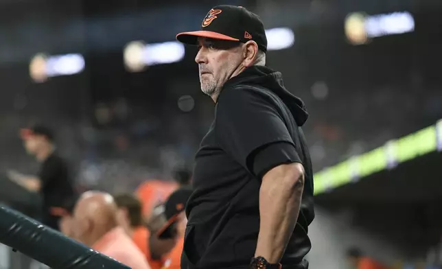 Baltimore Orioles manager Brandon Hyde watches from the dugout in the fifth inning of a baseball game against the Detroit Tigers, Friday, Sept. 13, 2024, in Detroit. (AP Photo/Jose Juarez)