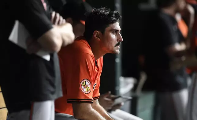 Baltimore Orioles starting pitcher Zach Eflin watches from the dugout after being taken out in the seventh inning of a baseball game against the Detroit Tigers, Friday, Sept. 13, 2024, in Detroit. (AP Photo/Jose Juarez)