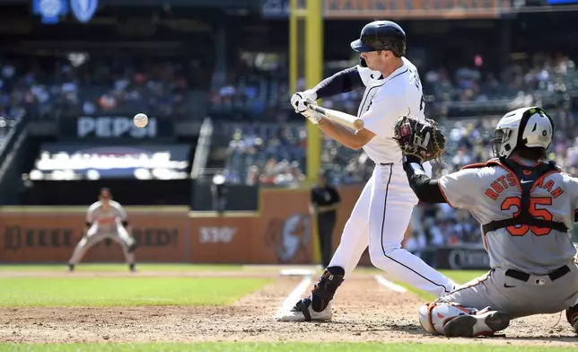 Detroit Tigers' Colt Keith hits an RBI single, scoring Matt Vierling, in the sixth inning of a baseball game against the Baltimore Orioles, Sunday, Sept. 15, 2024, in Detroit. (AP Photo/Jose Juarez)