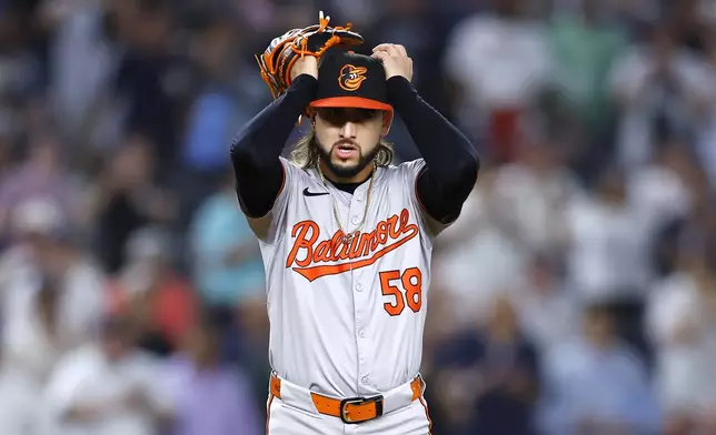 Baltimore Orioles pitcher Cionel Pérez reacts after loading the bases during the sixth inning of a baseball game against the New York Yankees, Thursday, Sept. 26, 2024, in New York. (AP Photo/Noah K. Murray)