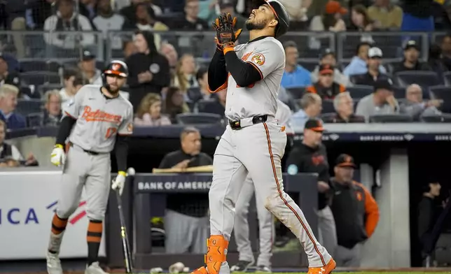 Baltimore Orioles' Anthony Santander crosses the plate after hitting a home run during the sixth inning of a baseball game against the New York Yankees, Tuesday, Sept. 24, 2024, in New York. (AP Photo/Bryan Woolston)