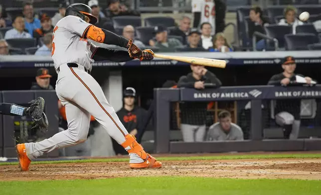 Baltimore Orioles' Anthony Santander hits a home run during the sixth inning of a baseball game against the New York Yankees, Tuesday, Sept. 24, 2024, in New York. (AP Photo/Bryan Woolston)