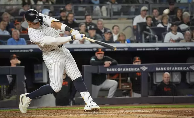 New York Yankees' Aaron Judge hits a home run during the fourth inning of a baseball game against the Baltimore Orioles, Tuesday, Sept. 24, 2024, in New York. (AP Photo/Bryan Woolston)