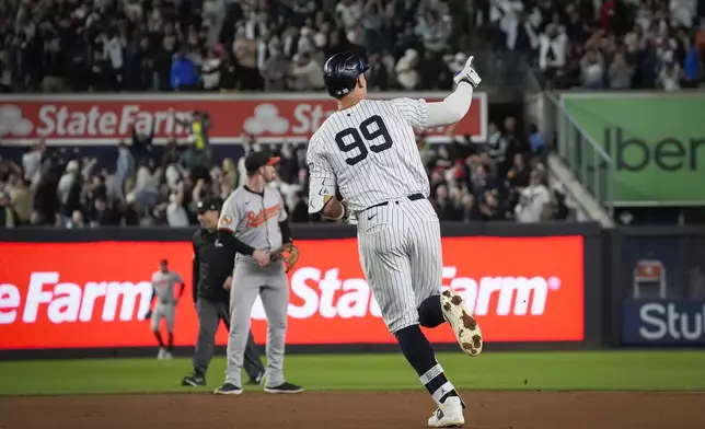 New York Yankees' Aaron Judge runs the basses after hitting a home run during the fourth inning of a baseball game against the Baltimore Orioles, Tuesday, Sept. 24, 2024, in New York. (AP Photo/Bryan Woolston)