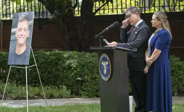 Bart Collart and Alexia Collart, right, speak about their son, Cpl. Spencer Collart, who was posthumously presented the USMCs highest non-combat medal, The Navy and Marine Corps Medal, during a ceremony on Monday, Sept. 16, 2024 in Washington. (AP Photo/Kevin Wolf)