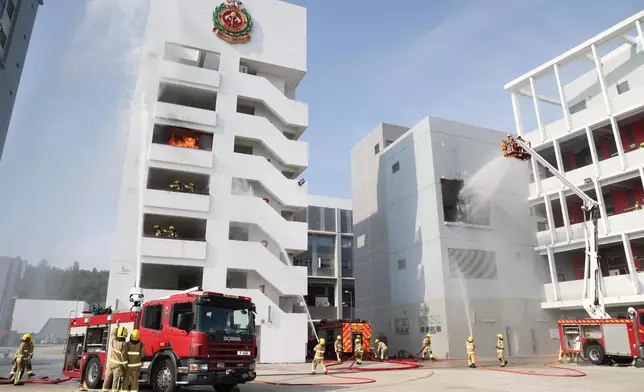 Deputy Director of Fire Services (Operations) reviews Fire Services passing-out parade  Source: HKSAR Government Press Releases