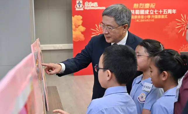 Schools hold flag-raising ceremonies to celebrate 75th anniversary of founding of People's Republic of China  Source: HKSAR Government Press Releases