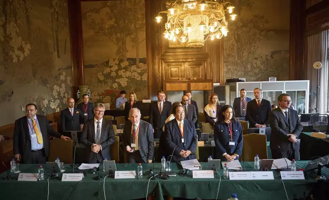 The Ukrainian delegation at the start of PCA Case between Ukraine and the Russian Federation in the Netherlands, Monday, Sept. 23, 2024. (AP Photo/Phil Nijhuis)