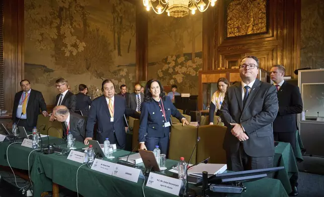 The Ukrainian delegation at the start of PCA Case between Ukraine and the Russian Federation in the Netherlands, Monday, Sept. 23, 2024. (AP Photo/Phil Nijhuis)