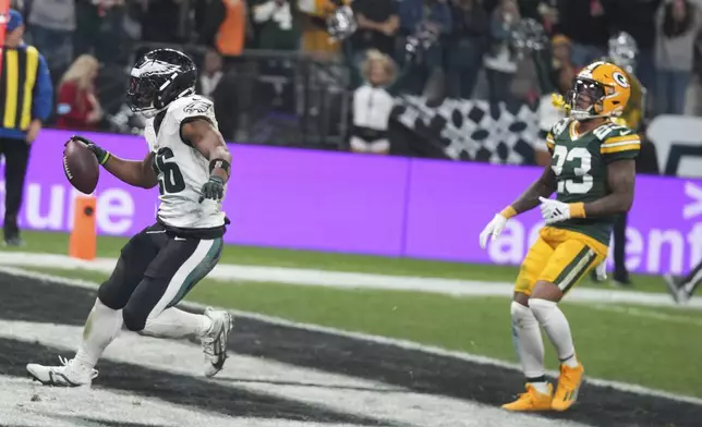 Philadelphia Eagles running back Saquon Barkley (26) celebrates after scoring against the Green Bay Packers during the first half of an NFL football game, Friday, Sept. 6, 2024, at the Neo Quimica Arena in Sao Paulo. (AP Photo/Fernando Llano)