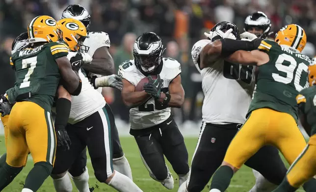 Philadelphia Eagles running back Saquon Barkley (26) runs for a touchdown against the Green Bay Packers during the second half of an NFL football game, Friday, Sept. 6, 2024, at the Neo Quimica Arena in Sao Paulo. (AP Photo/Fernando Llano)