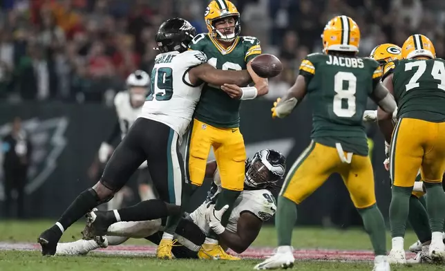 Green Bay Packers quarterback Jordan Love (10) gets hurt during the second half of an NFL football game against the Philadelphia Eagles, Saturday, Sept. 7, 2024, at the Neo Quimica Arena in Sao Paulo. (AP Photo/Andre Penner)