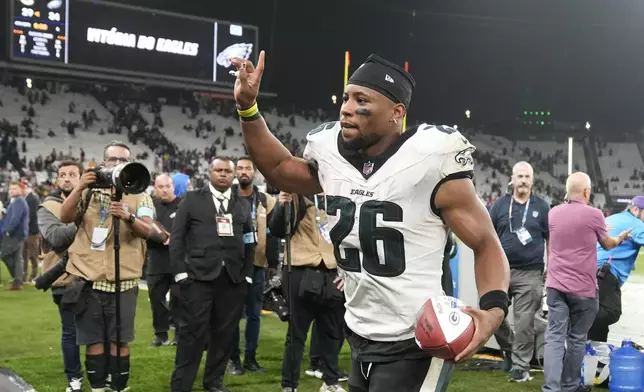 Philadelphia Eagles running back Saquon Barkley (26) leaves to field after their win against the Green Bay Packers in an NFL football game, Saturday, Sept. 7, 2024, at the Neo Quimica Arena in Sao Paulo. (AP Photo/Andre Penner)