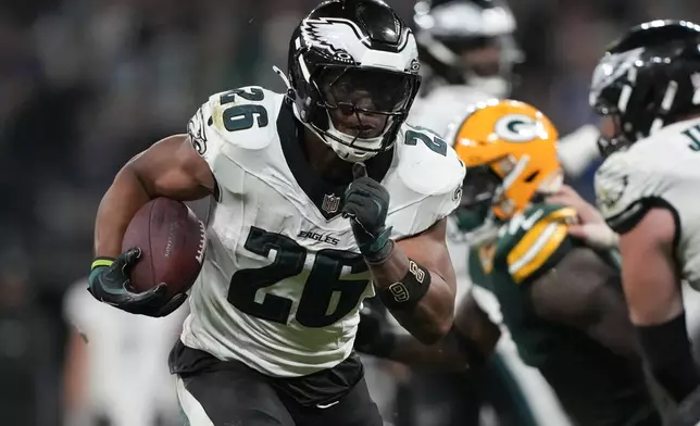 Philadelphia Eagles running back Saquon Barkley (26) runs for a touchdown against the Green Bay Packers during the first half of an NFL football game, Friday, Sept. 6, 2024, at the Neo Quimica Arena in Sao Paulo. (AP Photo/Doug Benc)