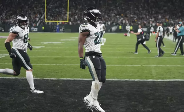 Philadelphia Eagles running back Saquon Barkley (26) celebrates after scoring against the Green Bay Packers during the first half of an NFL football game, Friday, Sept. 6, 2024, at the Neo Quimica Arena in Sao Paulo. (AP Photo/Fernando Llano)