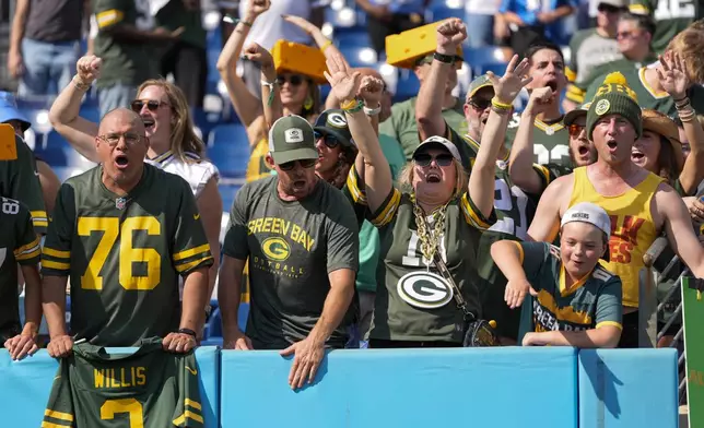 Green Bay Packers fans cheer after an NFL football game against the Tennessee Titans Sunday, Sept. 22, 2024, in Nashville, Tenn. (AP Photo/George Walker IV)