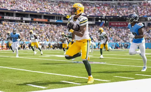 Green Bay Packers' Jaire Alexander returns an interception for a touchdown during the first half of an NFL football game against the Tennessee Titans Sunday, Sept. 22, 2024, in Nashville, Tenn. (AP Photo/George Walker IV)