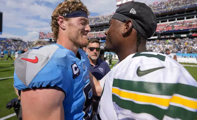 Green Bay Packers' Malik Willis talks to Tennessee Titans' Will Levis after an NFL football game Sunday, Sept. 22, 2024, in Nashville, Tenn. (AP Photo/George Walker IV)