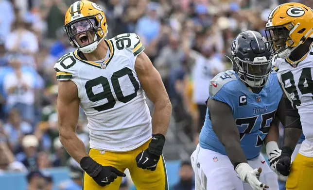 Green Bay Packers' Lukas Van Ness celebrates his sack of Tennessee Titans quarterback Will Levis during the first half of an NFL football game Sunday, Sept. 22, 2024, in Nashville, Tenn. (AP Photo/John Amis)