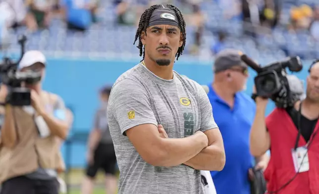 Green Bay Packers' Jordan Love watches before an NFL football game against the Tennessee Titans Sunday, Sept. 22, 2024, in Nashville, Tenn. (AP Photo/George Walker IV)