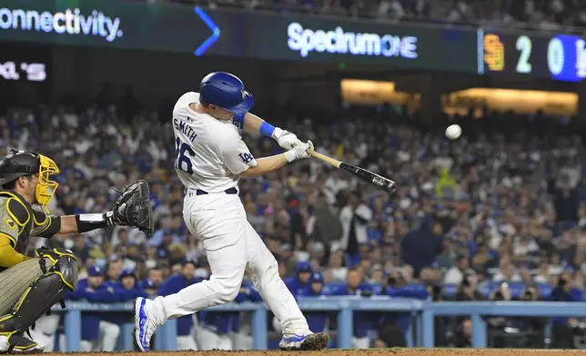 Los Angeles Dodgers' Will Smith hits a two-run home run during the seventh inning of a baseball game against the San Diego Padres, Thursday, Sept. 26, 2024, in Los Angeles. (AP Photo/Mark J. Terrill)