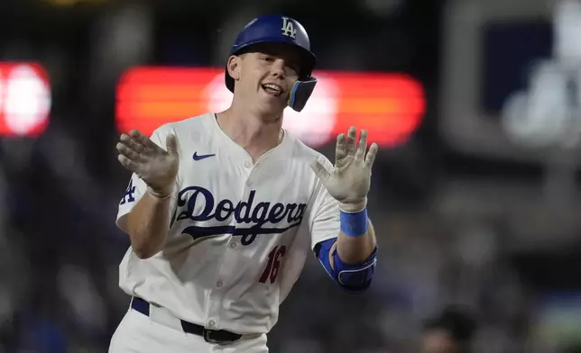 Los Angeles Dodgers' Will Smith celebrates after hitting a two-run home run during the seventh inning of a baseball game against the San Diego Padres, Thursday, Sept. 26, 2024, in Los Angeles. (AP Photo/Ashley Landis)