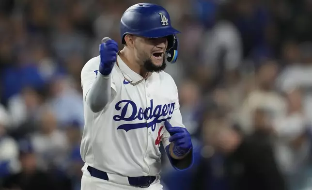 Los Angeles Dodgers' Andy Pages celebrates his two-run home run during the eighth inning of a baseball game against the San Diego Padres, Thursday, Sept. 26, 2024, in Los Angeles. (AP Photo/Ashley Landis)