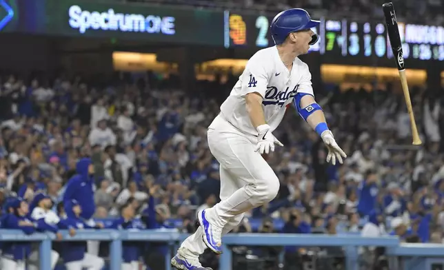 Los Angeles Dodgers' Will Smith watches his two-run home run during the seventh inning of a baseball game against the San Diego Padres, Thursday, Sept. 26, 2024, in Los Angeles. (AP Photo/Mark J. Terrill)