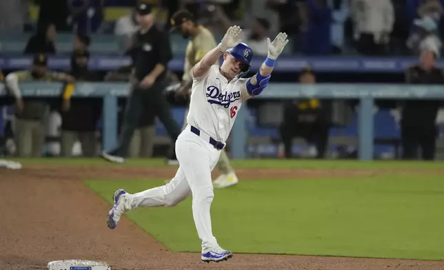 Los Angeles Dodgers' Will Smith celebrates his two-run home run during the seventh inning of a baseball game against the San Diego Padres, Thursday, Sept. 26, 2024, in Los Angeles. (AP Photo/Mark J. Terrill)