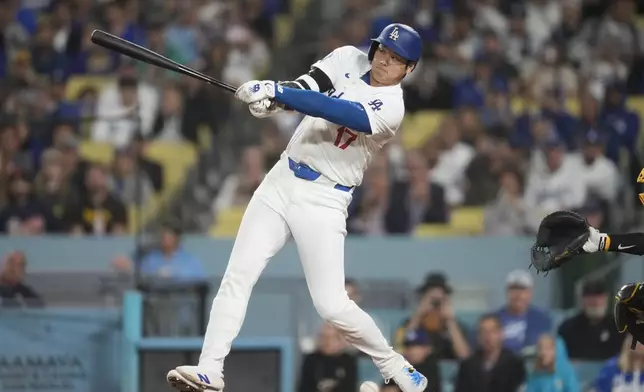 Los Angeles Dodgers' Shohei Ohtani grounds out while batting during the third inning of a baseball game against the San Diego Padres, Thursday, Sept. 26, 2024, in Los Angeles. (AP Photo/Ashley Landis)