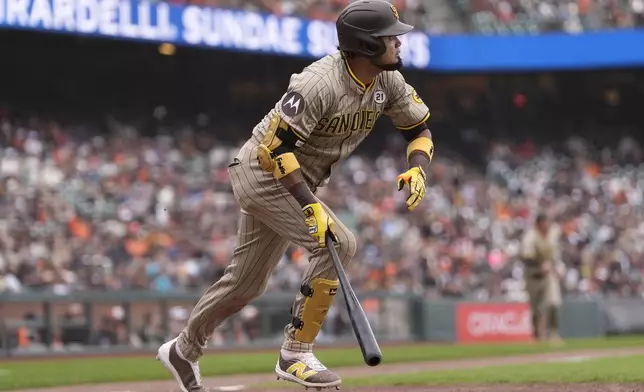 San Diego Padres' Luis Arraez watches his double during the 10th inning of a baseball game against the San Francisco Giants in San Francisco, Sunday, Sept. 15, 2024. (AP Photo/Jeff Chiu)